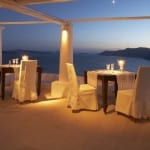 Katikies dining experience under the moonlight romantic couple sunset glow Luxury Getaway Holiday Uniq Luxe