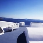 Relax katikies santorini greece oia blue sky and ocean Luxury Getaway Holiday Uniq Luxe