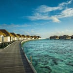 Maalifushi by COMO Maldives resort rows of overwater villas Luxury Holiday Retreat Getaway Honeymoon Uniq Luxe