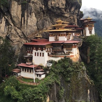 The iconic temple hanging by the side of the cliff in Bhutan, a must-see on a Bhutan trip