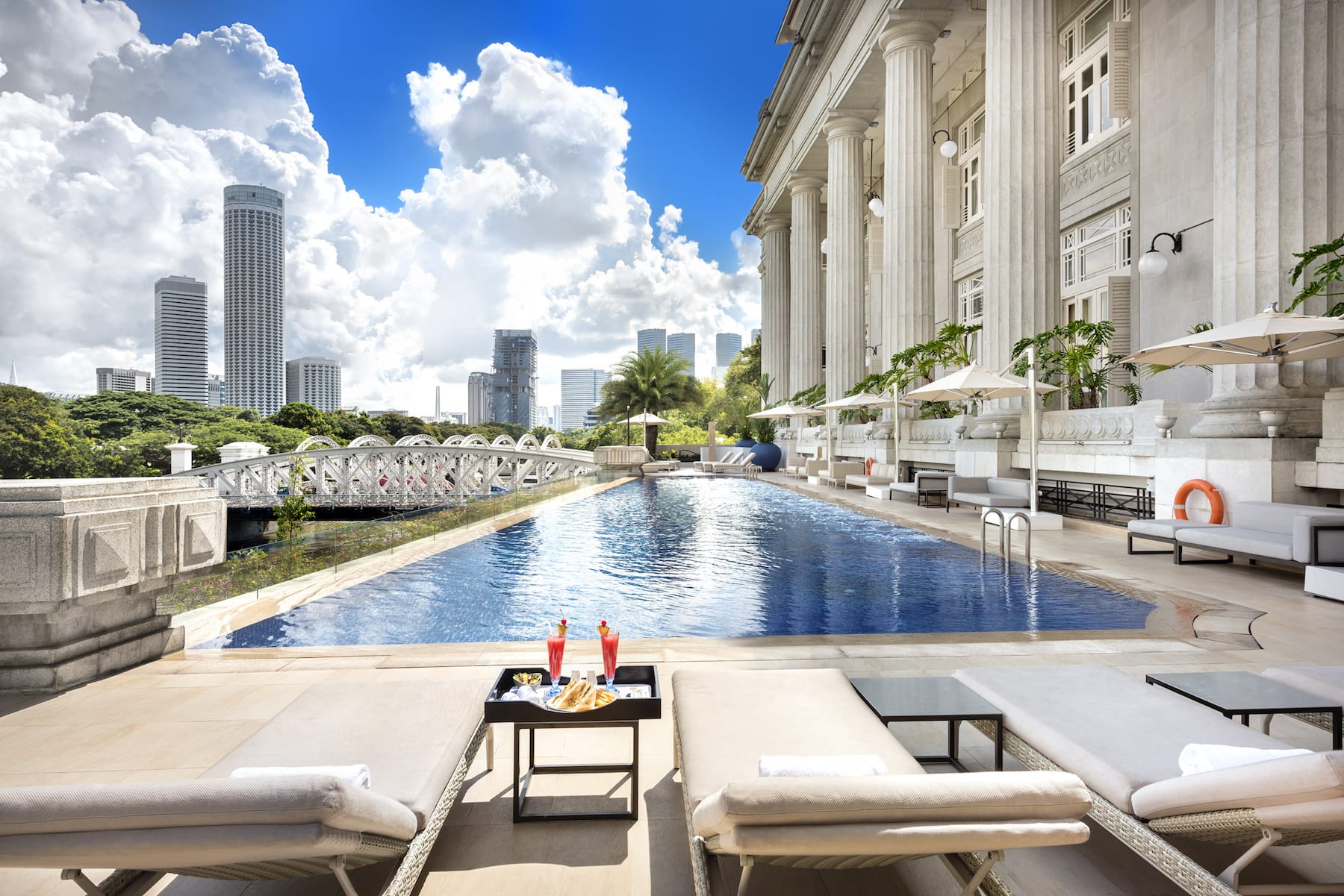 https://uluxeimages.uniqluxe.com/2020/08/the-fullerton-hotel-singapore-swimming-pool.jpg