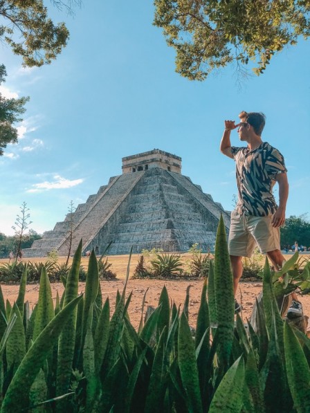 A tourist explores the ancient Mayan temple of Chichen Itza in Mexico, a remarkable sight to see on a North American luxury holiday