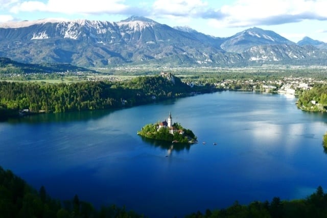 Scenic mountain views surround Lake Bled and the mysterious island in the middle...a must-visit on your luxury vacation to Europe!